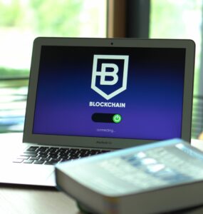 Laptop displaying blockchain connecting screen in modern setting.
